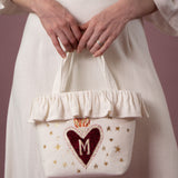 Clara ft. Flaming Heart Monogram Appliqué